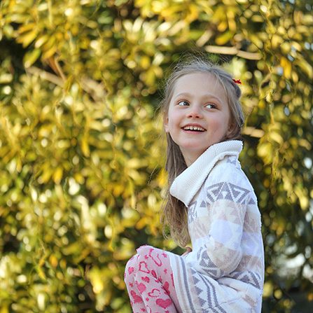 The girl by the hedge resized to a square with Squishless